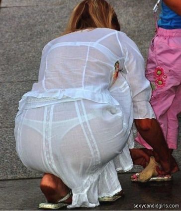 Woman Bending Over In See Thru Dress