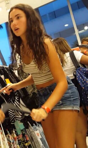 Young Teen In Denim Shorts Shopping