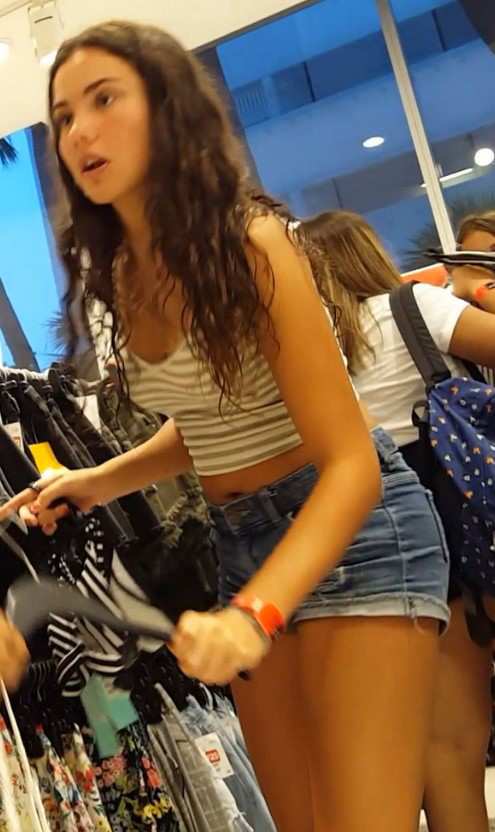 Young Teen In Denim Shorts Shopping