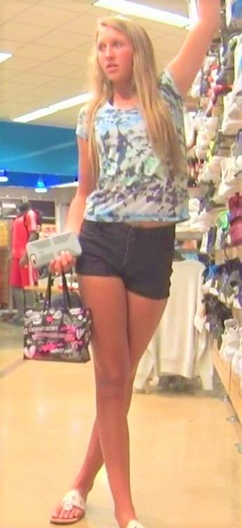 Two Young Teens In Shorts Shopping