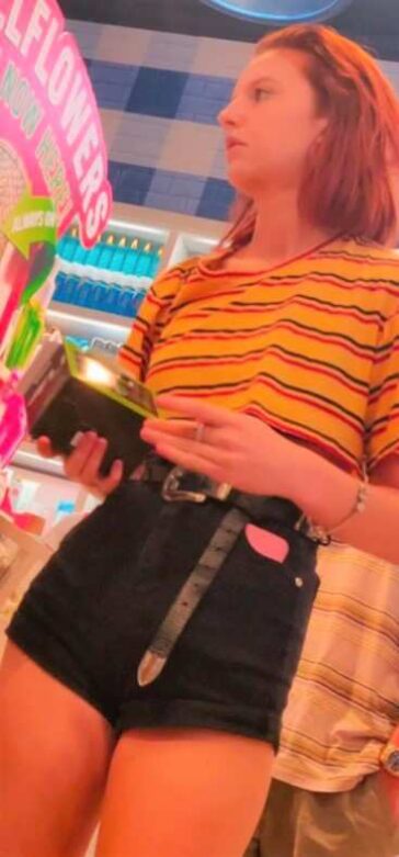 Cheeky Redhead Teen In Black Shorts