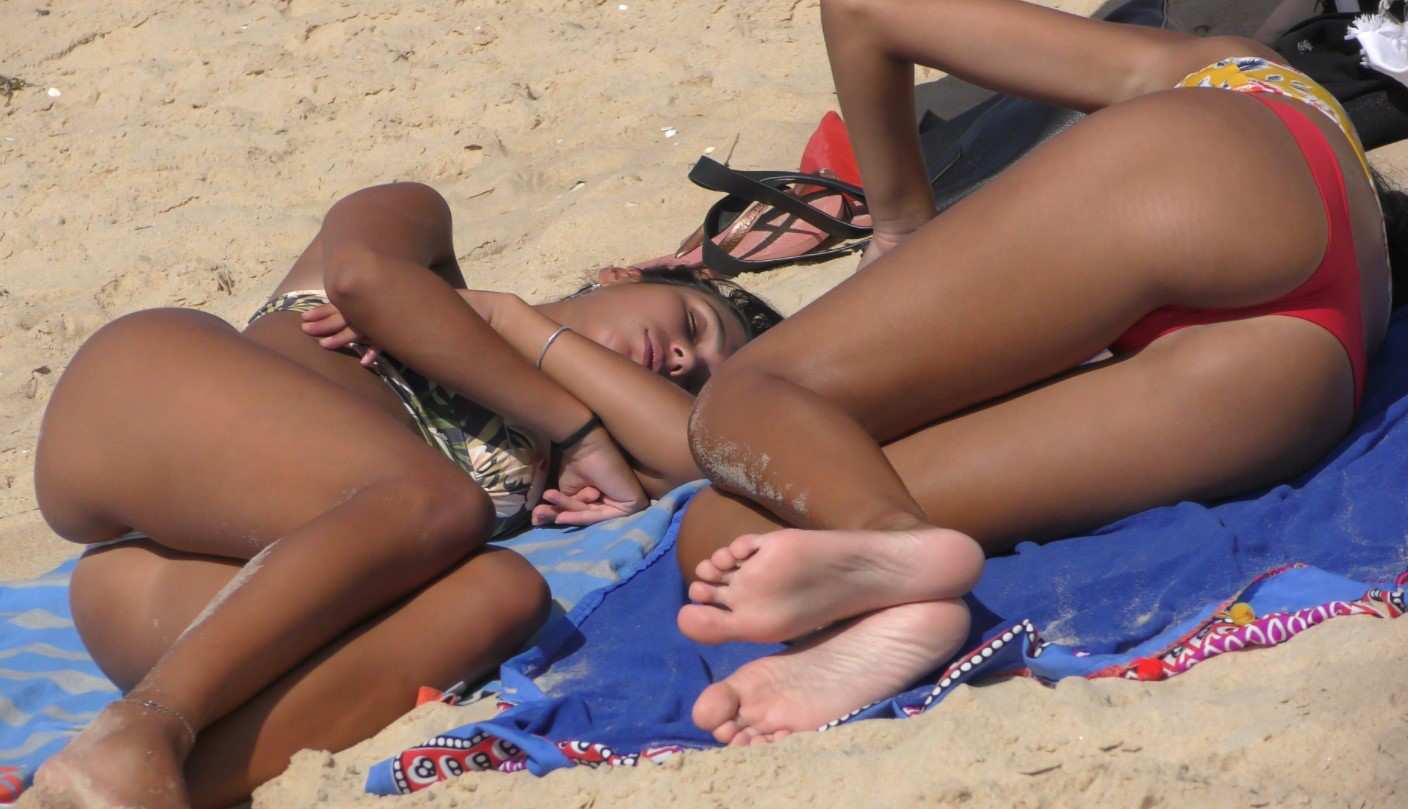 Two Candid Teens In Thong Sunbathing