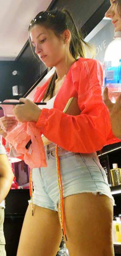 Cheeky Girl In Shorts Shopping