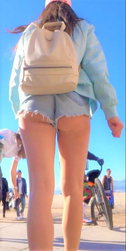 Cheeky Brunette Teen In Shorts