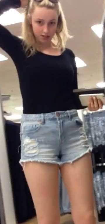 Blonde Teen In Shorts Shopping With Friends