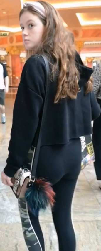 Cute Teen In Black Leggings Shopping