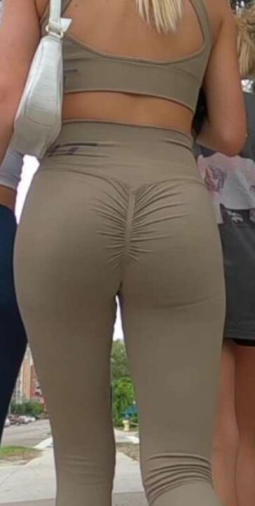 Fit Blonde In Green Leggings Going To The Gym