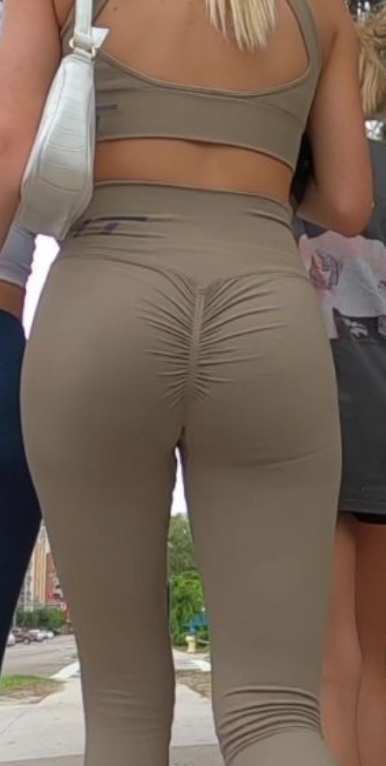 Fit Blonde In Green Leggings Going To The Gym