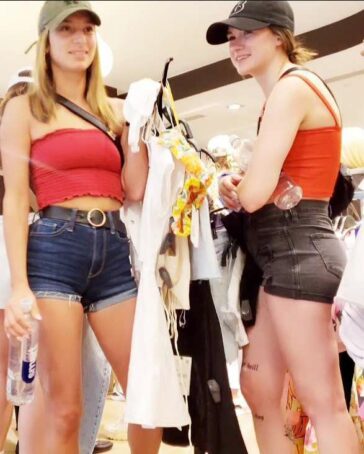 Two Teens In Shorts Shopping