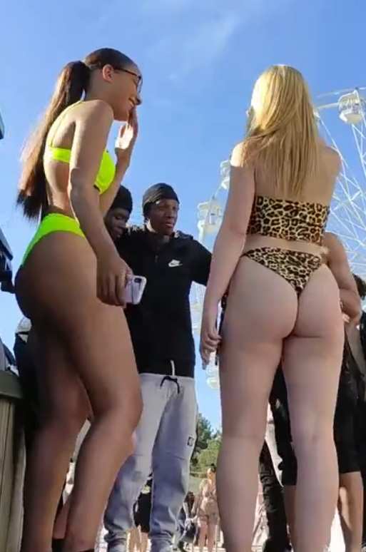 Two Thonged Girls Flirting With Guys
