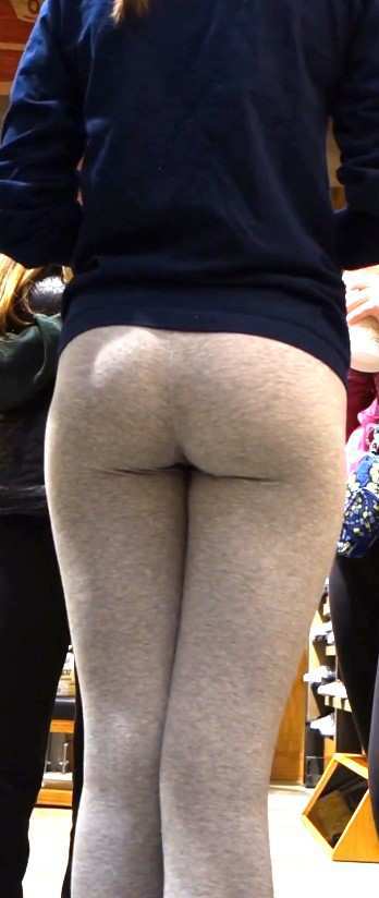 Young Teen Shopping In Grey Leggings