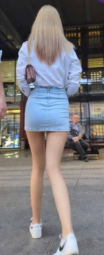 Skinny Blonde In Short Skirt