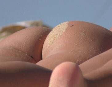 Two Young Bunnies In Thong On The Beach