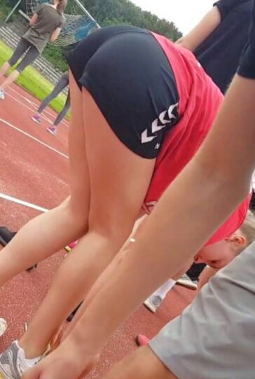 Cutie Bending Over In Black Shorts